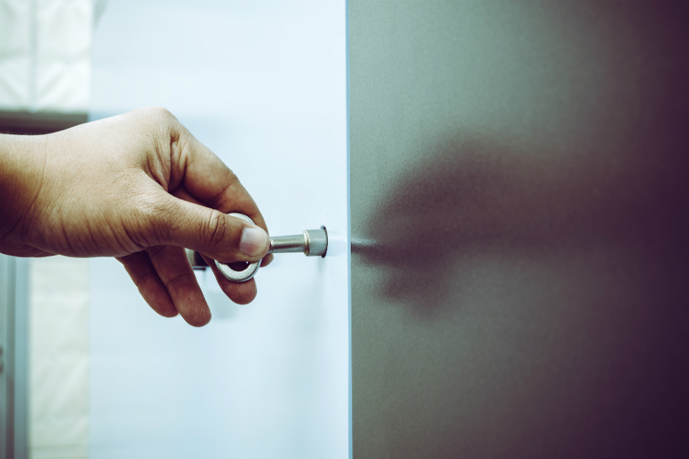 Person opening the door using key